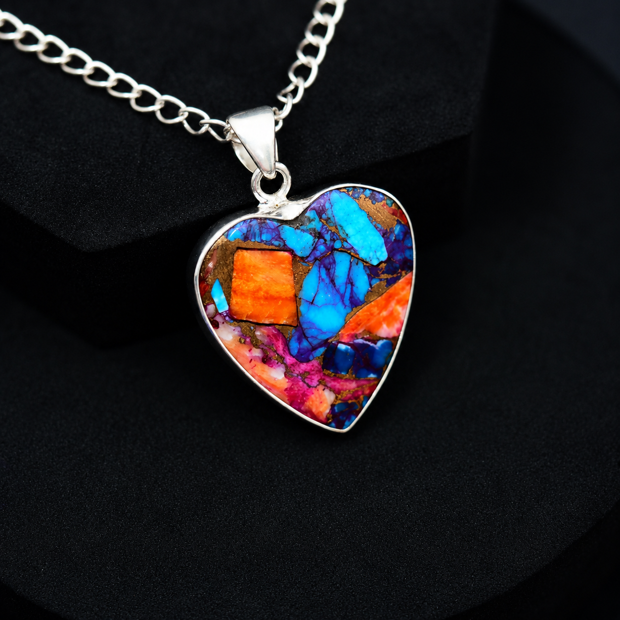 Sterling silver heart pendant necklace close-up on neutral background