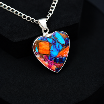 Sterling silver heart pendant necklace close-up on neutral background